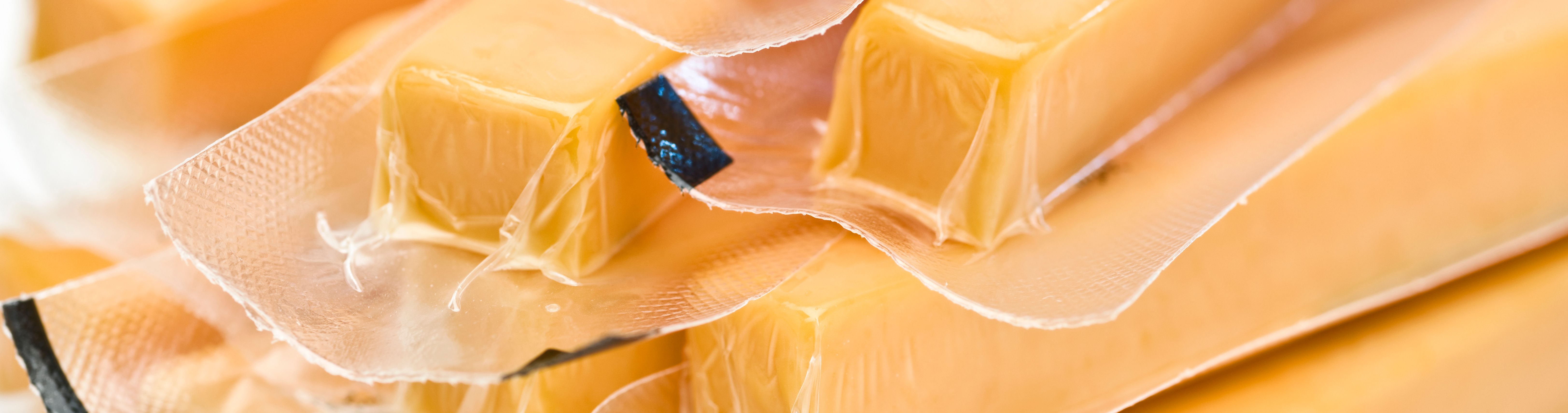 yellow cheese in transparent packaging